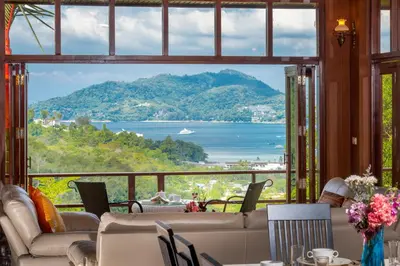 a living room with a view of the ocean at Patong Hill Estate 6 in Patong Beach