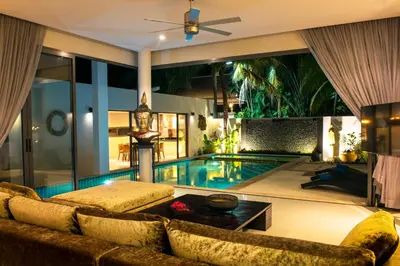 a living room with a pool and a couch at Amazing 5br, Seaview private PoolVilla by Intira Villas in Rawai Beach