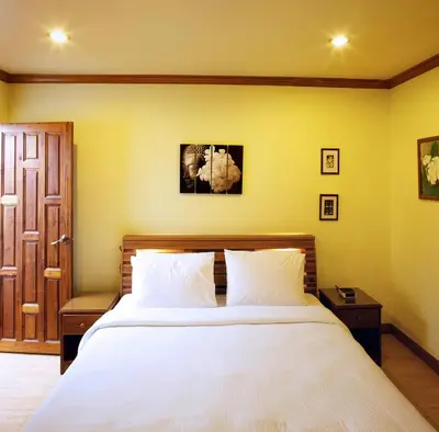 a bedroom with a large white bed with two pillows at Thara Bayview Villa, SHA Certified in Ao Nang Beach