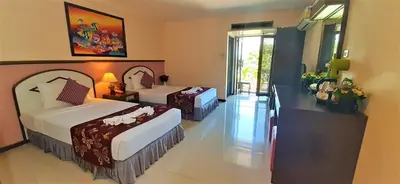 a hotel room with two beds and a balcony at D2 lamoon resotel in Phuket Town
