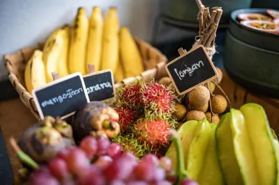 a bunch of fruits and vegetables on a table at CC's Hideaway Kata - SHA Plus in Kata Beach