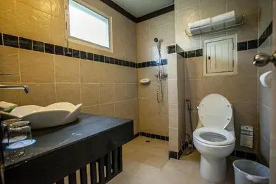 a bathroom with a toilet and a sink at P.P. Casita - Adult Only in Phi Phi Don