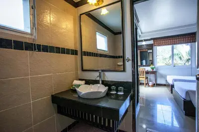 a bathroom with a sink and a mirror at P.P. Casita - Adult Only in Phi Phi Don