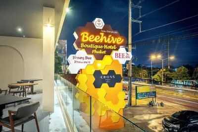 a sign for a beehive bar and restaurant at Beehive Boutique Hotel Phuket in Phuket Town