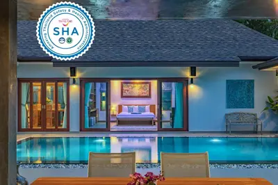 a villa with a swimming pool in a resort at Bangtao Boutique Villa in Bang Tao Beach