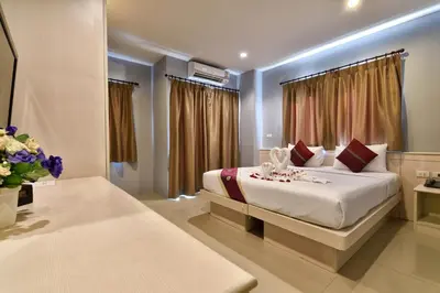 a bedroom with a large bed in a room at 88 Hotel in Patong Beach