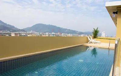 a swimming pool on the roof of a building at 88 Hotel in Patong Beach