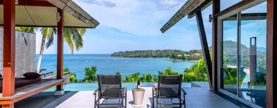 a house with a view of the ocean at Surin Beach Oceanfront Villa with Ocean and Beach views in Surin Beach