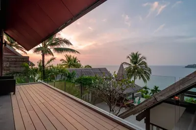 a view of the ocean from the balcony of a house at Surin Beach Oceanfront Villa with Ocean and Beach views in Surin Beach