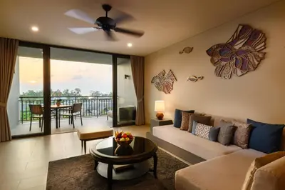 a living room with a couch and a ceiling fan at Anantara Vacation Club Mai Khao Phuket in Mai Khao Beach