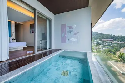 a swimming pool in a house with a view at Cape Sienna Phuket Gourmet Hotel & Villas - SHA Extra Plus in Kamala Beach