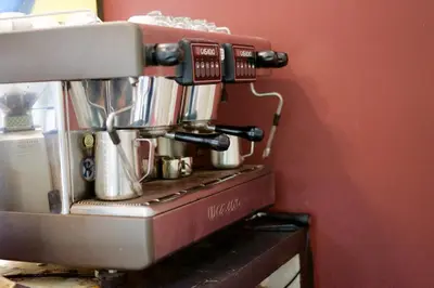 a coffee maker sitting on top of a counter at Kata Guesthouse Tuscany in Kata Beach