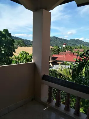 a room with a view of a field from a window at Thalassa in Nai Harn Beach