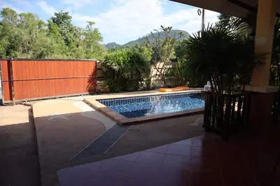 a swimming pool in the middle of a yard at Relax private Pool Villas - 4 bedroom villas in Ao Nang Beach