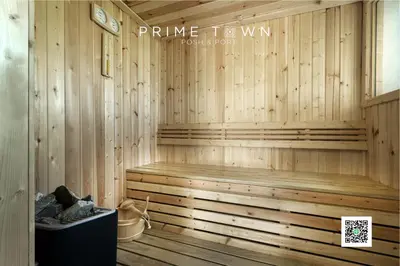 a wooden sauna with a bench in the corner at PRIME TOWN - Posh & Port Hotel PHUKET in Phuket Town