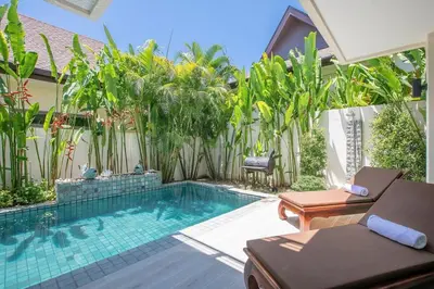 a swimming pool in a backyard with plants at VILLA Bangka 4BR Private pool villa Rawai in Rawai Beach