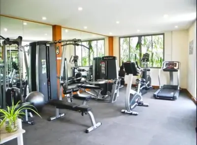 a gym with several treadmills and machines in a room at VILLA Bangka 4BR Private pool villa Rawai in Rawai Beach