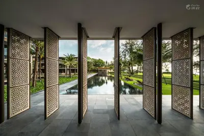 an open door with a view of a pool at Baan Mai Khao in Mai Khao Beach