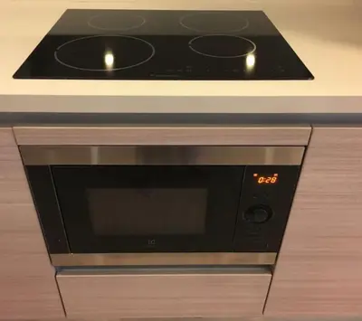a microwave oven sitting on top of a counter at Baan Mai Khao in Mai Khao Beach