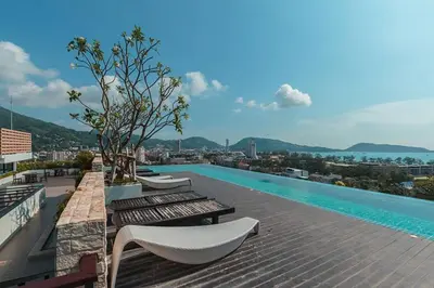 a swimming pool on the roof of a building at WOW Apartment at Unity Patong in Patong Beach