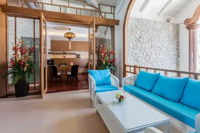 a living room with a couch and a table at Beyond Karon in Karon Beach