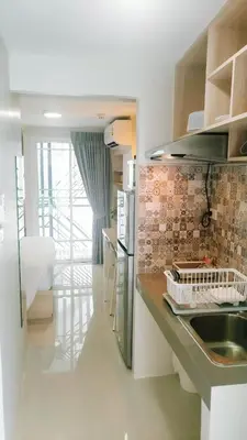 a kitchen with a sink and a counter top at beHOME Phuket in Nai Yang Beach