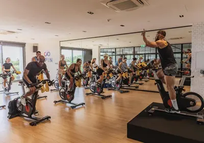 a group of people on bikes in a gym at Stay Wellbeing & Lifestyle Resort in Rawai Beach