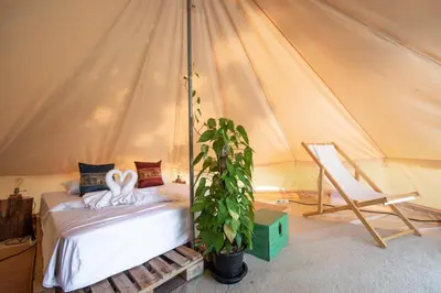 a bedroom with a bed in a tent at Roost Glamping - SHA Certified in Rawai Beach