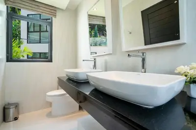 a bathroom with a large white sink and a toilet at 360 Degree Kamala Seaview Villa in Kamala Beach
