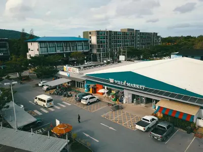 an aerial view of a parking lot in a city at Oceanstone by Holy Cow, studio, next building view in Bang Tao Beach