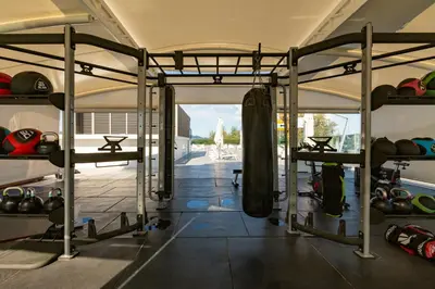 a room with a gym with a rack of equipment at Oceanstone by Holy Cow, studio, next building view in Bang Tao Beach