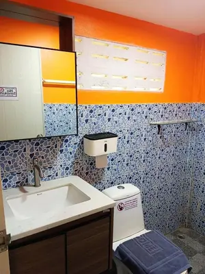 a bathroom with a sink and a toilet at Ban Elephant Blanc Bungalow in Kata Beach