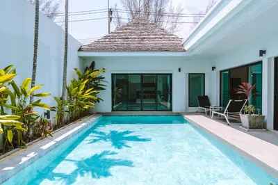 a swimming pool in the backyard of a villa at Layantara Villas in Layan Beach