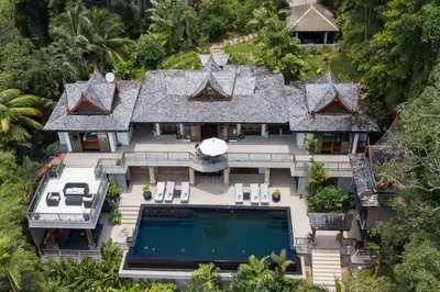 an aerial view of a house with a swimming pool at Luxury 4 bedrooms Villa with Seaview Infinity Pool overlooking Surin Beach in Surin Beach