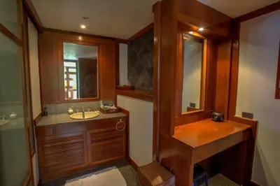 a bathroom with a sink and a mirror at Luxury 4 bedrooms Villa with Seaview Infinity Pool overlooking Surin Beach in Surin Beach