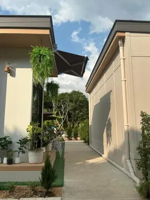 a garage with an umbrella on the side of a house at Loma Place in Ao Nang Beach