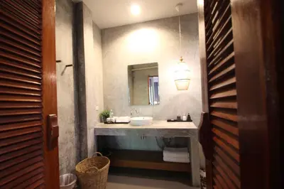 a bathroom with a sink and a mirror at Bliss Resort Krabi in Klong Muang Beach