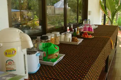 a table with food on it in a room with a table sidx sidx at Camp Hadee Koh Yao Noi in Ko Yao Noi