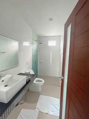 a bathroom with a sink and a toilet and a mirror at Bests Villa - Rawai Beach Phuket in Rawai Beach