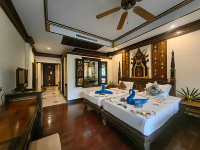 a bedroom with a large bed in a room at Ayodhaya Palace Beach Resort - SHA Plus certified in Ao Nang Beach