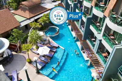 an aerial view of a swimming pool at a resort at Ramaburin Resort Patong - SHA Extra Plus in Patong Beach