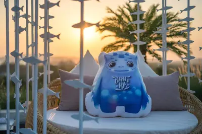 a blue bear sitting on top of a wicker chair at Anda Sea Tales Resort-SHA Plus in Ao Nang Beach