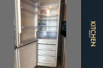 an empty refrigerator with its door open in a kitchen at 3 BR Amazing Condo with Private Rooftop Pool in Kamala Beach