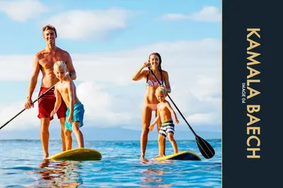 a man and a woman and two children on surfboards in the water at 3 BR Amazing Condo with Private Rooftop Pool in Kamala Beach