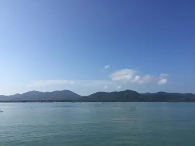a view of the water with mountains in the background at Connexion in Ko Yao Noi