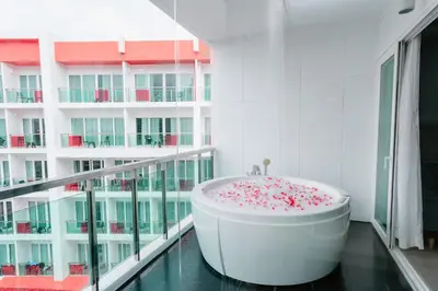 a bathroom with a bath tub filled with sprinkles at SLEEP WITH ME HOTEL design hotel @ patong (SHA Plus+) in Patong Beach