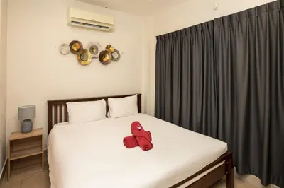 a red stuffed animal sitting on top of a bed at Beautiful 5BR Villa Felicity, Pool & Garden, near Naiharn in Rawai Beach