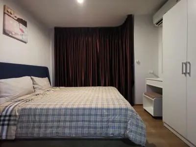 a bedroom with a bed in front of a window at 2 Floor - Centrio Condominium near Central Shopping Mall and Phuket Old town in Phuket Town
