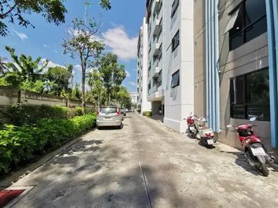 a car parked on a street next to a building at 2 Floor - Centrio Condominium near Central Shopping Mall and Phuket Old town in Phuket Town