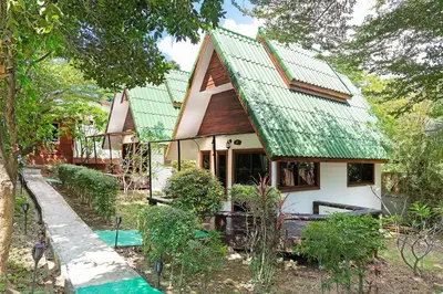 a small house with a green roof at Harmony Naturist Resort Rawai Phuket 18yr minimum age only nudist nake d FKK in Rawai Beach